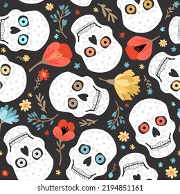 Seamless vector pattern of skulls and flowers. Day of the Dead.