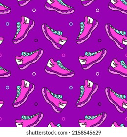 Seamless vector pattern with sneakers on purple background. 