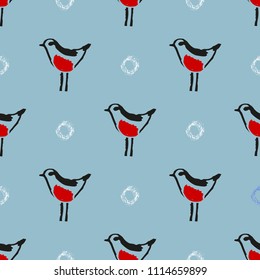 Seamless vector pattern with snow and bullfinch. Hand drawn winter background.