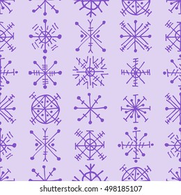 Seamless vector pattern with snowflakes. Blue winter background with decorative hand drawn snow flakes. Graphic illustration. Series of winter seamless vector patterns.