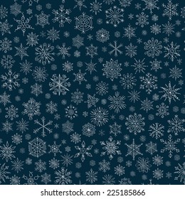 seamless vector  pattern of snowflakes on a blue background