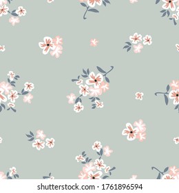 Seamless vector pattern with summer flowers on grey background. Vintage print with small inflorescences.  Retro textile collection.