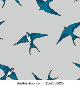 Patrón vectorial sin soldadura con golondrinas sobre fondo gris. Manada romántica del diseño de papel tapiz de aves. Pájaro azul decorativo textil de moda.