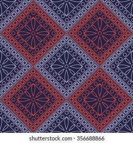 Seamless vector pattern. Symmetrical geometric background with blue and red rhombus and circles on the dark backdrop. Decorative ornament.
