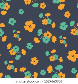 A seamless vector pattern with teal and yellow flowers on a dark graphite background. Moody feminine surface print design. Great for home decor, apparel and paper.