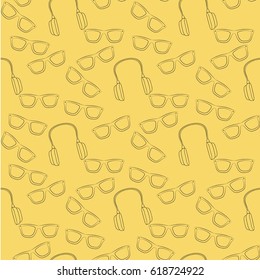 Seamless vector pattern. Teenager bright set with sunglasses and earphones pattern on the yellow background.