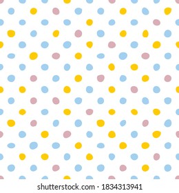 Seamless vector pattern or texture with colorful pink, yellow, green and violet polka dots on white background