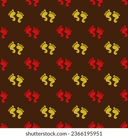 Seamless vector pattern with traditional Indian design of rangoli with yellow and orange footprints of Krishna or Lakshmi.