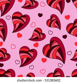 Seamless vector pattern. Valentine's Day background with colored hearts on the pink.
