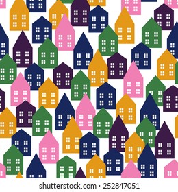 Seamless vector pattern with various cartoon houses. Child drawing style background.