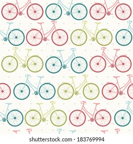 Seamless vector  pattern with vintage bicycles on spotted background