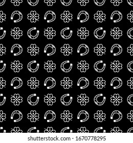 Seamless vector pattern with white clover leaves, shamrock and Horseshoe on a black backdrop for St. Patrick's Day. Spring fest background for greetings card, decor, flyer, print, packaging etc.