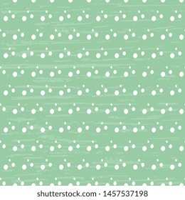 Seamless vector pattern of white polka dots on a green background, for the hoop, the surface, packaging, postcards. Abstract fun illustration.

