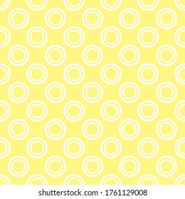 Seamless vector pattern with white polka dots on a sunny yellow background