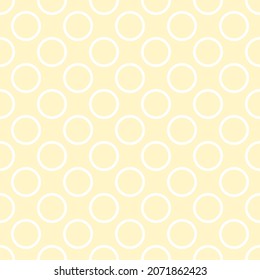 Seamless vector pattern with white polka dots on a sunny yellow background