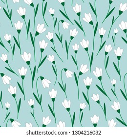 Seamless vector pattern with white snowdrop flowers. For decoration, wrapping paper or textile.