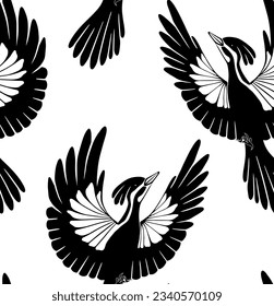 Seamless vector pattern of woodpeckers silhouettes. Texture with black stylized bird on white background. Surface design. Ornithology background for fabric and wallpaper