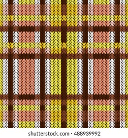 Seamless vector pattern as a woollen Celtic tartan plaid or a knitted fabric mainly in brown, yellow and white colors