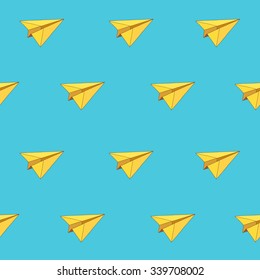 Seamless vector pattern of yellow paper airplanes on a blue background.