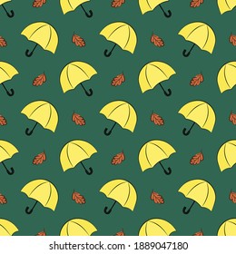 Seamless vector pattern with yellow umbrellas and orange oak leaves on green background