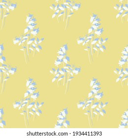 Seamless vector pattern.Floral pattern.Silhouettes of bells.Multi-layer vector file.Multi-layer pattern.White and gray bell silhouettes on a yellow background.For finishing fabrics, paper,wallpaper.