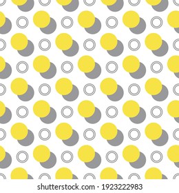 Seamless vector polka dot pattern.  Geometric summer design with trendy circle shapes. Yellow and gray spots on a simple white background. Perfect for fashion, textile design, home decor, and fabric.