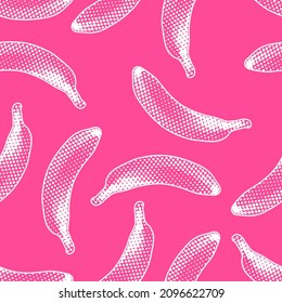 Seamless vector pop art pattern of pink and white bananas randomly distributed on pink background in halftone dot style design.