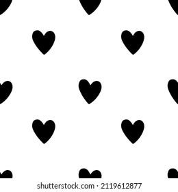 Seamless vector repeat pattern with small hand drawn doodle black hearts on white background. Simple cute kids Valentines day backdrop.