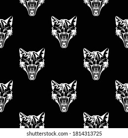 Seamless vector repeating pattern. Silver wolf head on a black background. Ornament of predators. Endless texture for textile design. Vector color backdrop.