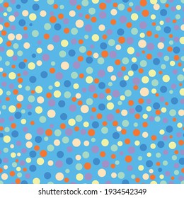 Seamless vector repeating vibrant multicolored polka dot random pattern scattered on a bright sky blue backdrop