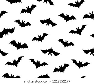 Seamless vector texture of various flying bat shapes. Different minimalistic black bats isolated on white background