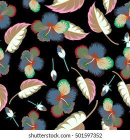 Seamless vector tropical design with hibiscus, leaves and buds on a black background. Exotic multicolor flowers in allover composition. Multicolor pattern for summer fashion, interior, wallpaper.