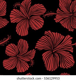 Seamless vector tropical design with hibiscus on a black background in red colors. Exotic flowers in allover composition. Pattern for summer fashion, interior, wallpaper.