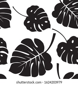 Seamless vector tropical pattern with black monstera palm leaves on white background. Exotic hawaiian fabric design