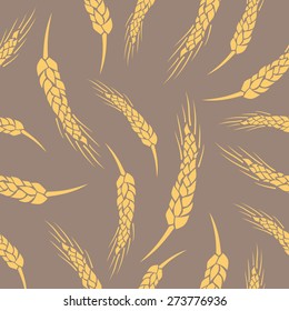 Seamless vector wheat ears pattern . Brown background
