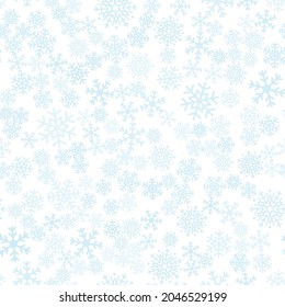 Seamless vector winter background of snowflakes placed chaotically. Winter fairy tale.