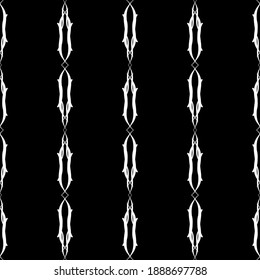 Seamless vertical vector lace pattern. White lace stripes on black background. Black and white graphics. For design and decor.