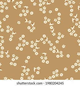 Seamless vintage abstract pattern. beige background. small white flowers. vector texture . fashion trend print for textiles and wallpaper.