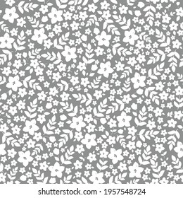 Seamless vintage abstract pattern. gray background. white flowers and leaves. vector texture. fashionable print for textiles and wallpaper.