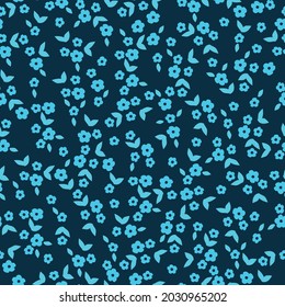Seamless vintage abstract pattern. small bright blue flowers and leaves on a dark blue background. vector texture. a trendy print for textiles and wallpaper.
