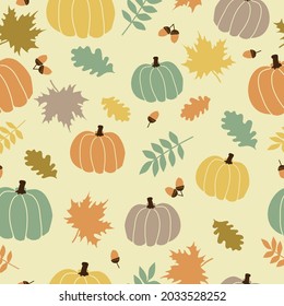 Seamless vintage autumn pattern . colored pumpkins and autumn leaves of trees on a light yellow background. vector texture. a trendy print for textiles and wallpaper.