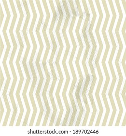 Seamless vintage beige pattern of thin vertical zigzag (chevron) on grange paper