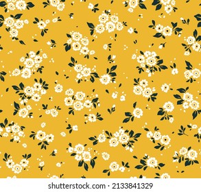 Seamless vintage floral pattern. Beautiful white flowers and black leaves on yellow background. Delicate flowers in ditsy style. Stock vector for prints on surface.