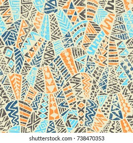 Seamless vintage geometric print. Ethnic and tribal motifs. Grunge texture. Gray, blue and orange colors. Vector illustration.