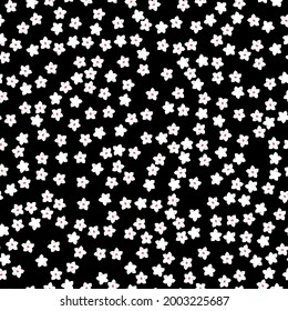 Seamless vintage pattern abstract. black background. small white flowers. vector texture. fashionable print for textiles and wallpaper.