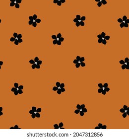 Seamless vintage pattern abstract. black flowers on a terracotta background. vector texture. trend print for textiles, wallpaper and packaging.