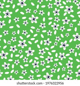 seamless vintage pattern abstract . bright green background. white flowers and petals. vector texture. fashionable print for textiles and wallpaper.