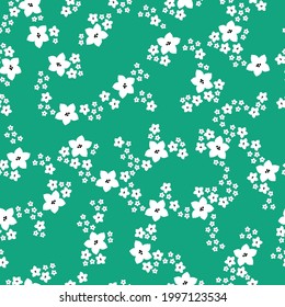 Seamless vintage pattern abstract. bright green background. white flowers . vector texture. trend print for textiles and wallpaper.