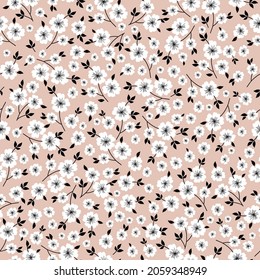 Seamless vintage pattern abstract. cute white flowers and black leaves on a beige background. vector texture. fashionable print for textiles, wallpaper and packaging.