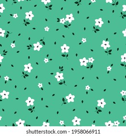 seamless vintage pattern of abstract flowers. bright green background. white flowers. vector texture. bright print for textiles and wallpaper.